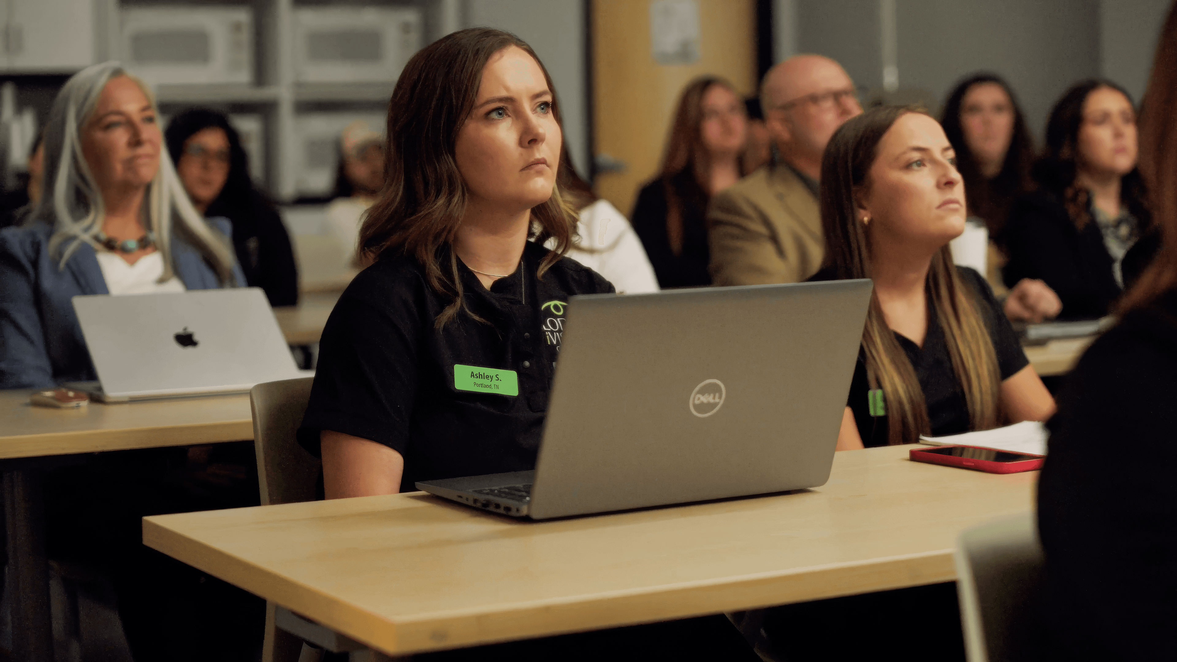 A person sitting at desk with a computer