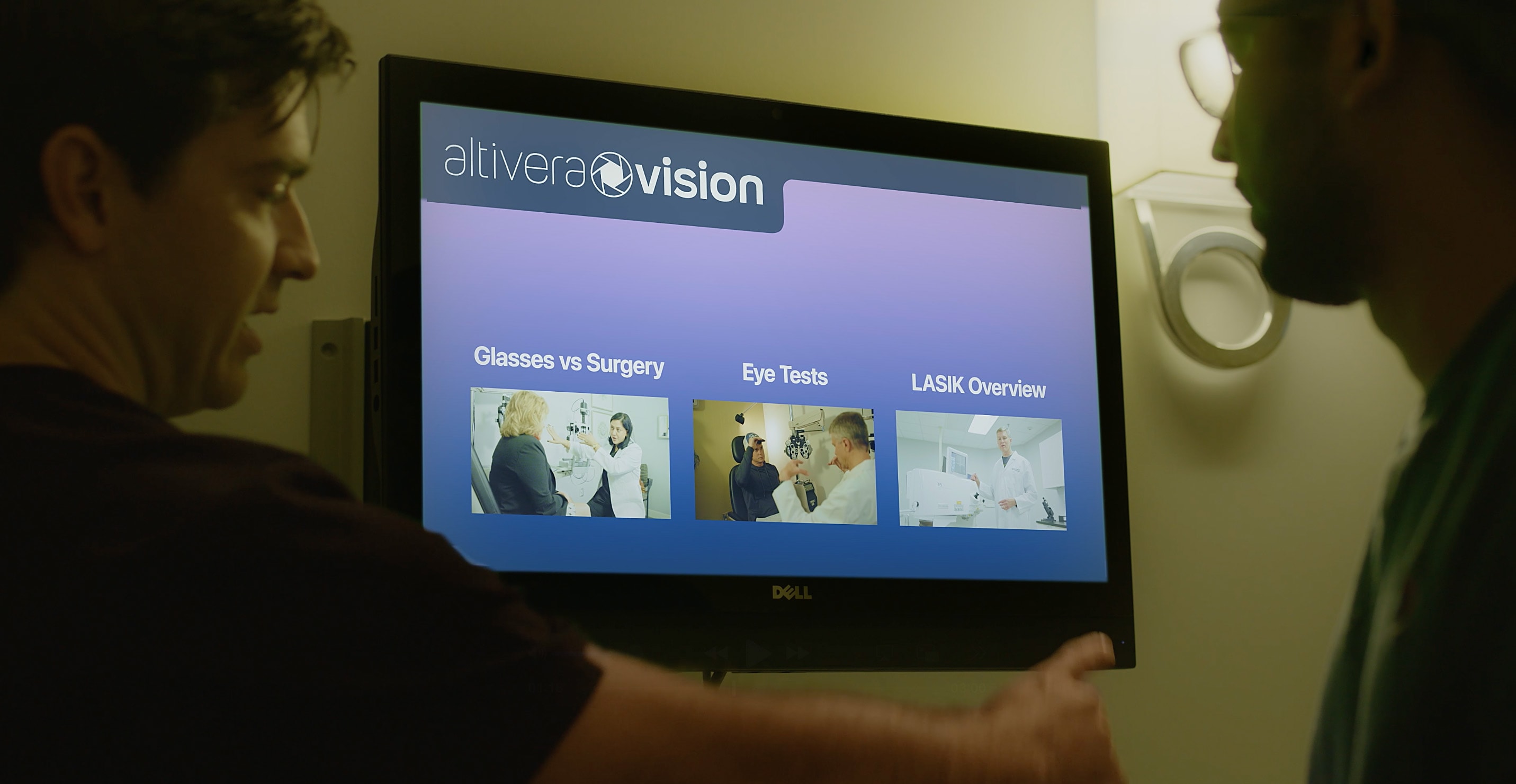 Two people looking at a screen